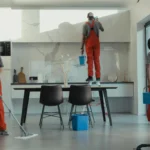 Team performing commercial and office cleaning in Fuquay Varina, NC, including mopping floors and cleaning windows.