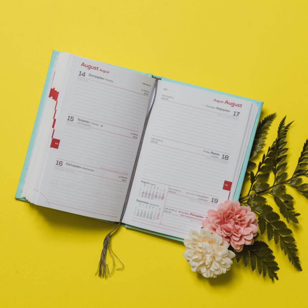 Daily planners diary on yellow background